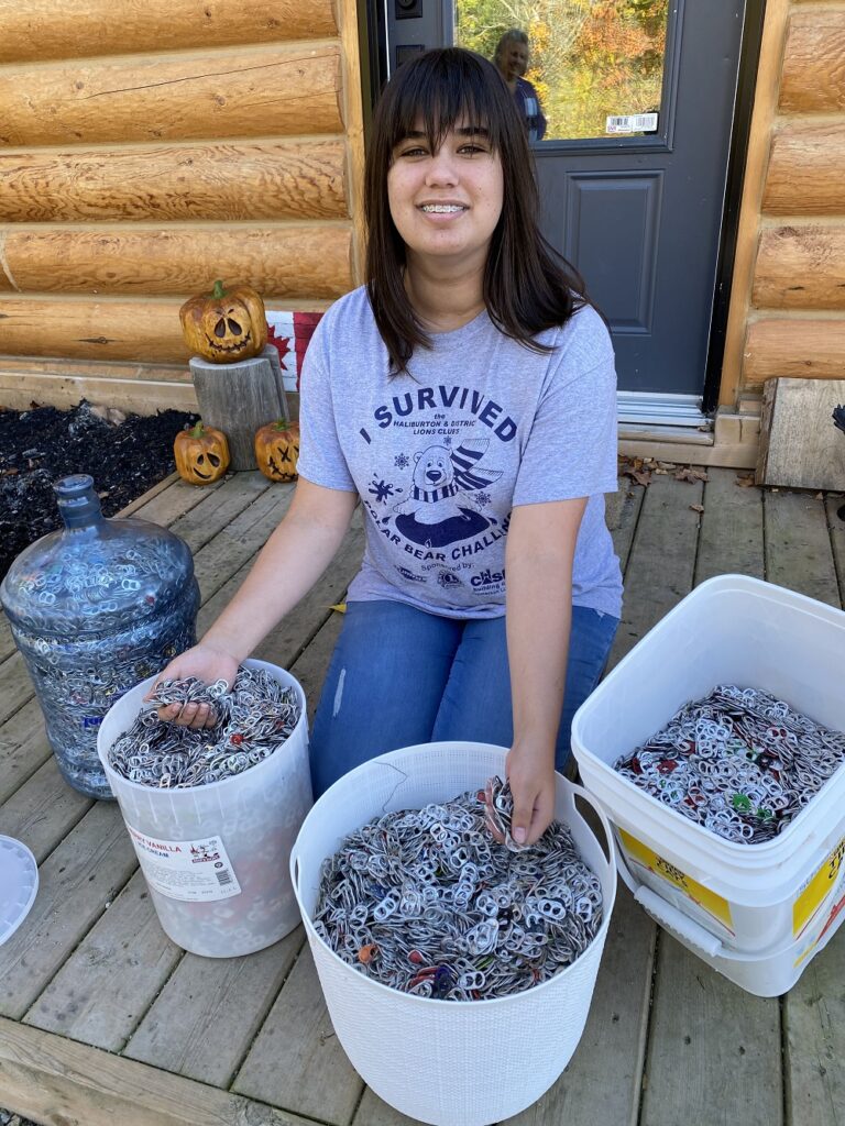 Teen collecting pop tabs to buy wheelchair The Highlander